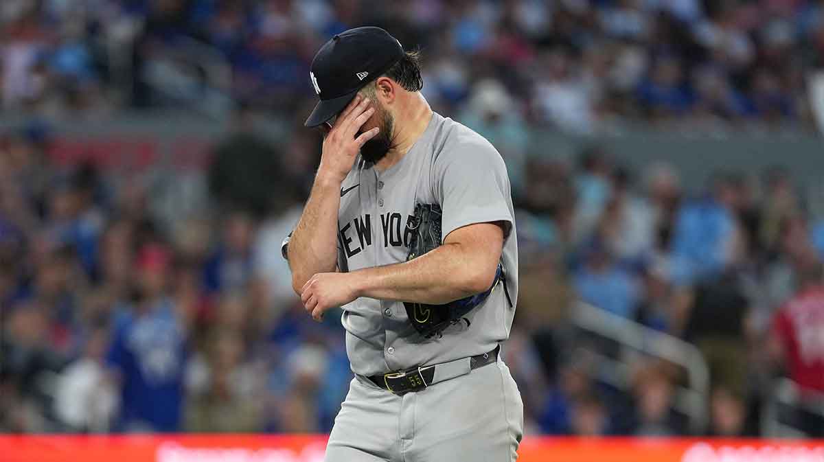 New York Yankees starting pitcher Carlos Rodon (55) walks towards the dugout against the Toronto Blue Jays during the fifth inning at Rogers Centre.
