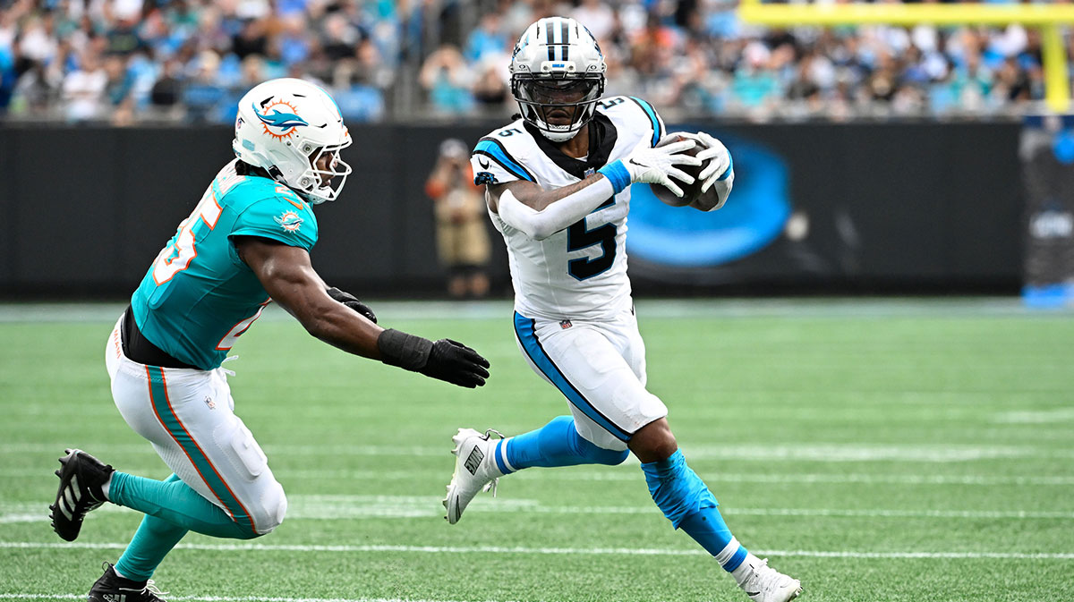 Carolina Panthers running back Rico Dowdle (5) with the ball as Miami Dolphins linebacker Tyrel Dodson (25) defends in the second quarter at Bank of America Stadium.