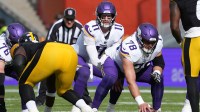 Minnesota Vikings quarterback Carson Wentz (11) takes the snap from center Ryan Kelly (78) in the first half against the Pittsburgh Steelers during an NFL International Series game at Croke Park.