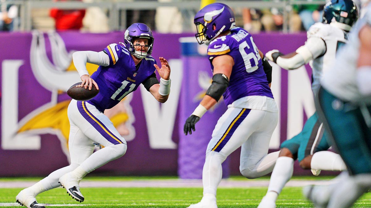 Minnesota Vikings quarterback Carson Wentz (11) runs the ball during the second half against the Philadelphia Eagles at U.S. Bank Stadium.