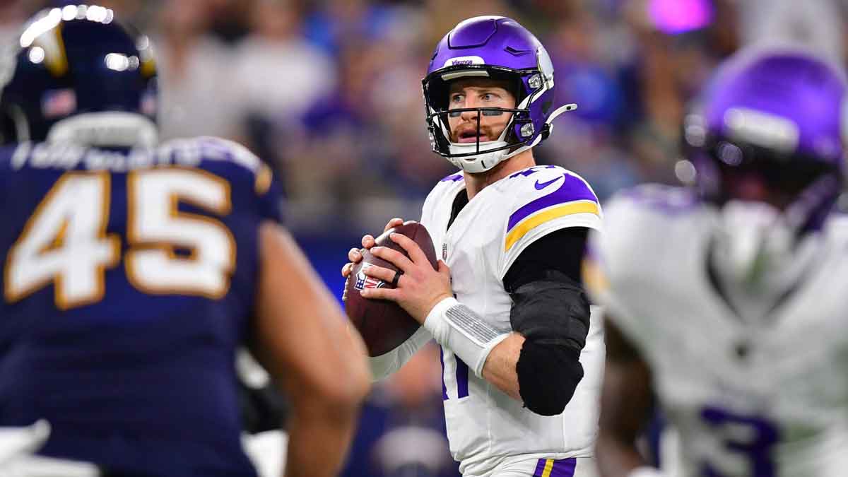Minnesota Vikings quarterback Carson Wentz (11) drops back to pass against the Los Angeles Chargers during the second half at SoFi Stadium.