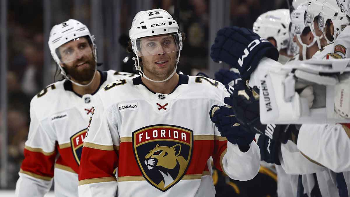 Florida Panthers center Carter Verhaeghe (23) is congratulated at the bench after scoring the winning goal against the Boston Bruins during the third period at TD Garden.