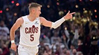 Cleveland Cavaliers guard Sam Merrill (5) celebrates after hitting a three point basket against the Milwaukee Bucks during the first half at Rocket Arena.