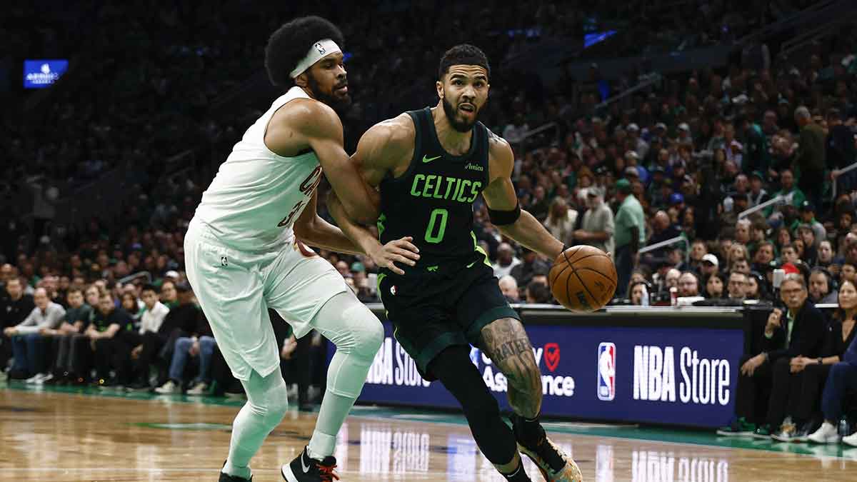 Cleveland Cavaliers center Jarrett Allen (31) tries to hold up Boston Celtics forward Jayson Tatum (0) during the first quarter at TD Garden.
