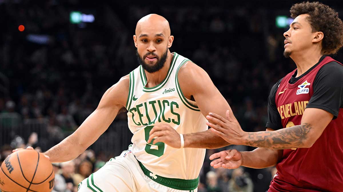 Boston Celtics guard Derrick White (9) drives to the basket against Cleveland Cavaliers guard Craig Porter Jr. (9) during the first half at TD Garden.