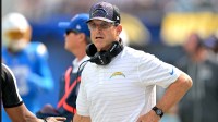 Los Angeles Chargers head coach Jim Harbaugh looks on in the first half against the Washington Commanders at SoFi Stadium.
