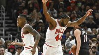 Feb 4, 2025; Chicago, Illinois, USA; Chicago Bulls forward Patrick Williams (44) reacts with guard Ayo Dosunmu (11) after he dunked the ball against the Miami Heat during the second half at United Center. Mandatory Credit: Matt Marton-Imagn Images