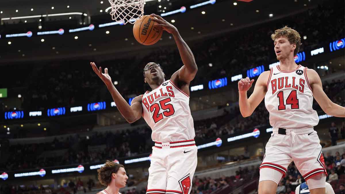Oct 16, 2025; Chicago, Illinois, USA; Chicago Bulls forward/center Jalen Smith (25) and forward Matas Buzelis (14) go up for a rebound against the Minnesota Timberwolves during the first half at United Center. Mandatory Credit: David Banks-Imagn Images