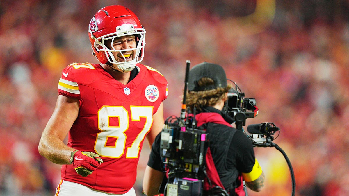Kansas City Chiefs tight end Travis Kelce (87) celebrates after scoring a touchdown against the Washington Commanders during the third quarter of the game at GEHA Field at Arrowhead Stadium.