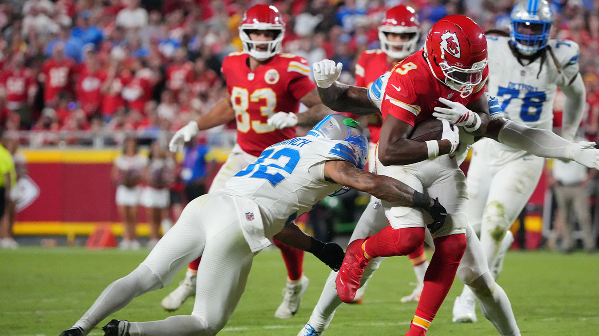 Kansas City Chiefs wide receiver Juju Smith-Schuster (9) makes a catch over Detroit Lions safety Brian Branch (32) during the second half at GEHA Field at Arrowhead Stadium.