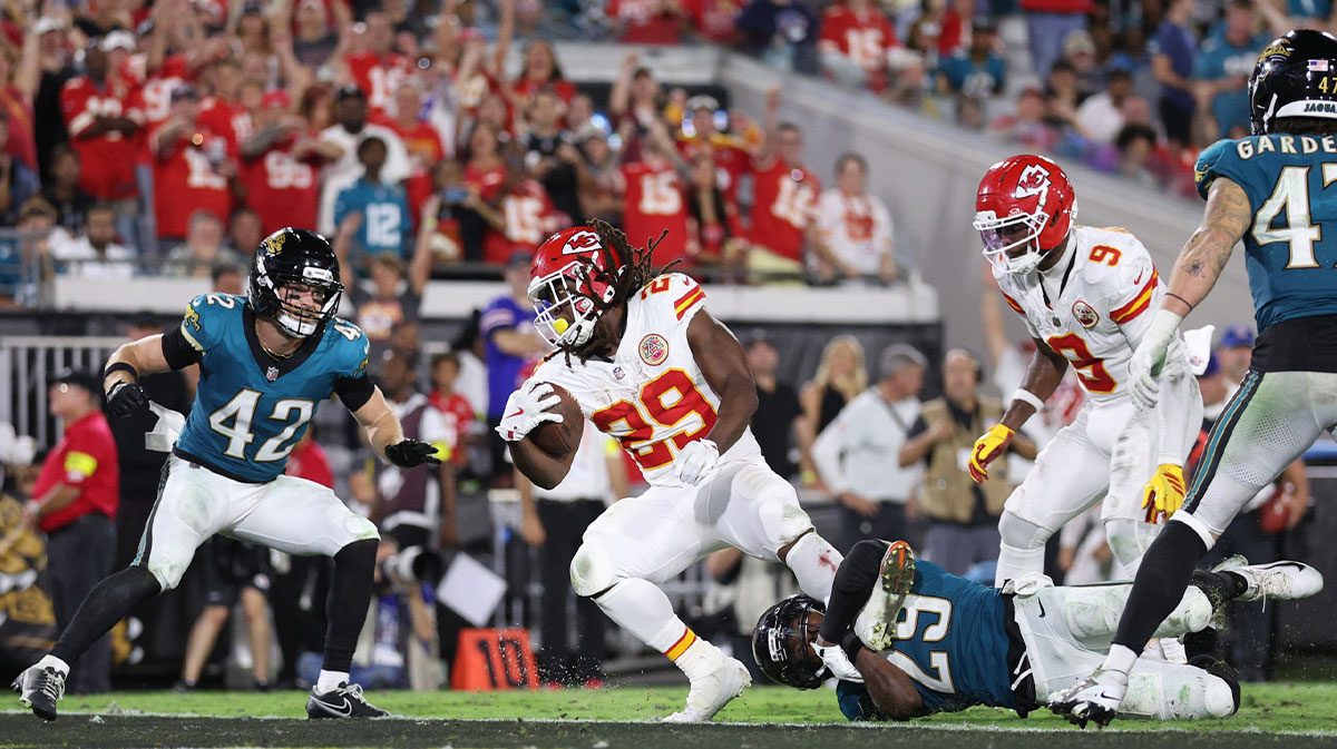 Kansas City Chiefs running back Kareem Hunt (29) scores a touchdown against Jacksonville Jaguars safety Andrew Wingard (42) and safety Eric Murray (29) during the second half at EverBank Stadium.