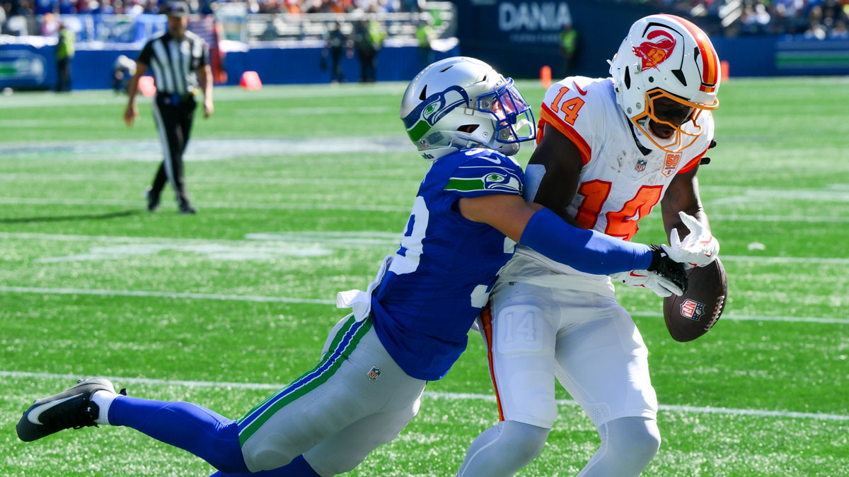 Seattle Seahawks safety Ty Okada (39) breaks up a pass to Tampa Bay Buccaneers wide receiver Chris Godwin Jr. (14) during the first half at Lumen Field.