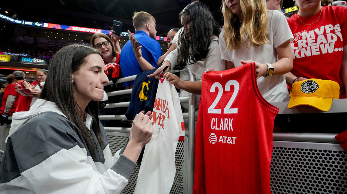 Indiana Fever guard Caitlin Clark (22) signs autographs Friday, Sept. 26, 2025, ahead of Game 3 of the WNBA semifinals against the Las Vegas Aces at Gainbridge Fieldhouse in Indianapolis.