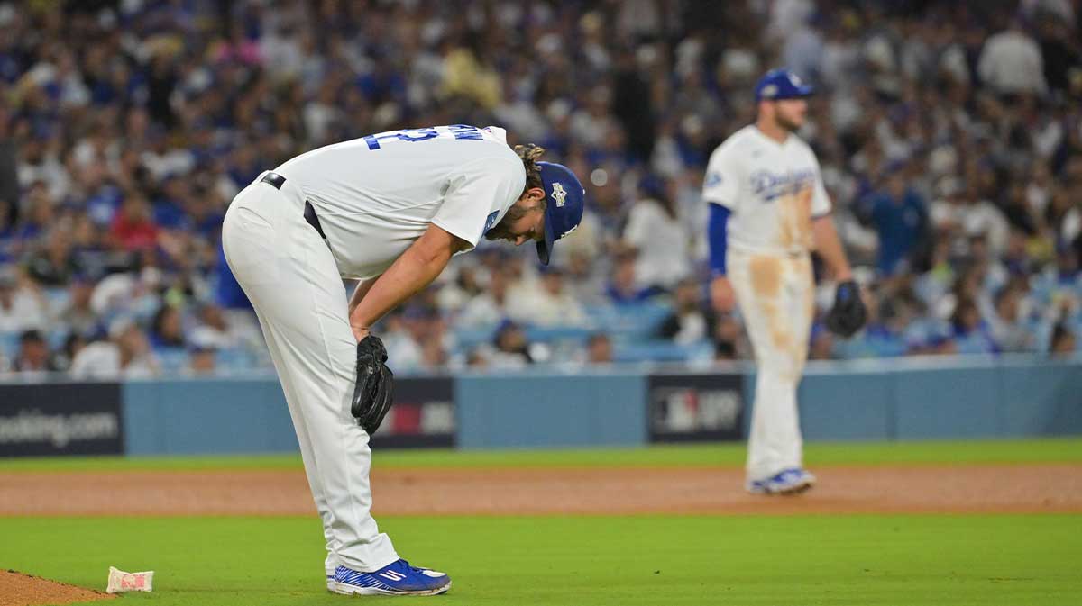 Los Angeles Dodgers pitcher Clayton Kershaw (22) reacts after giving up a home run during the eighth inning against the Philadelphia Phillies during game three of the NLDS round for the 2025 MLB playoffs at Dodger Stadium.