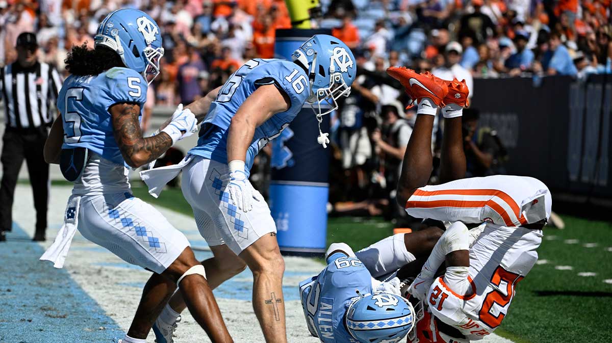 Clemson Tigers wide receiver Bryant Wesco Jr. (12) attempts to catch a pass in the end zone as North Carolina Tar Heels defensive back Marcus Allen (29) defends in the first quarter at Kenan Stadium.