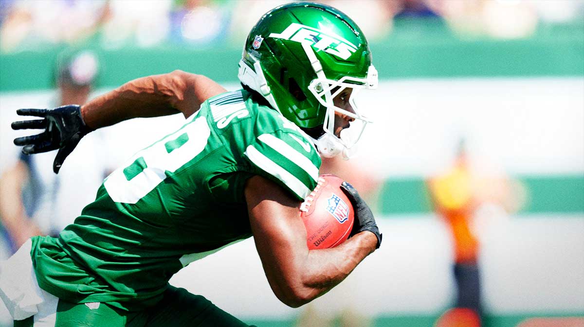 Isaiah Williams, of the New York Jets, runs after catching the punt return a Bills punt,