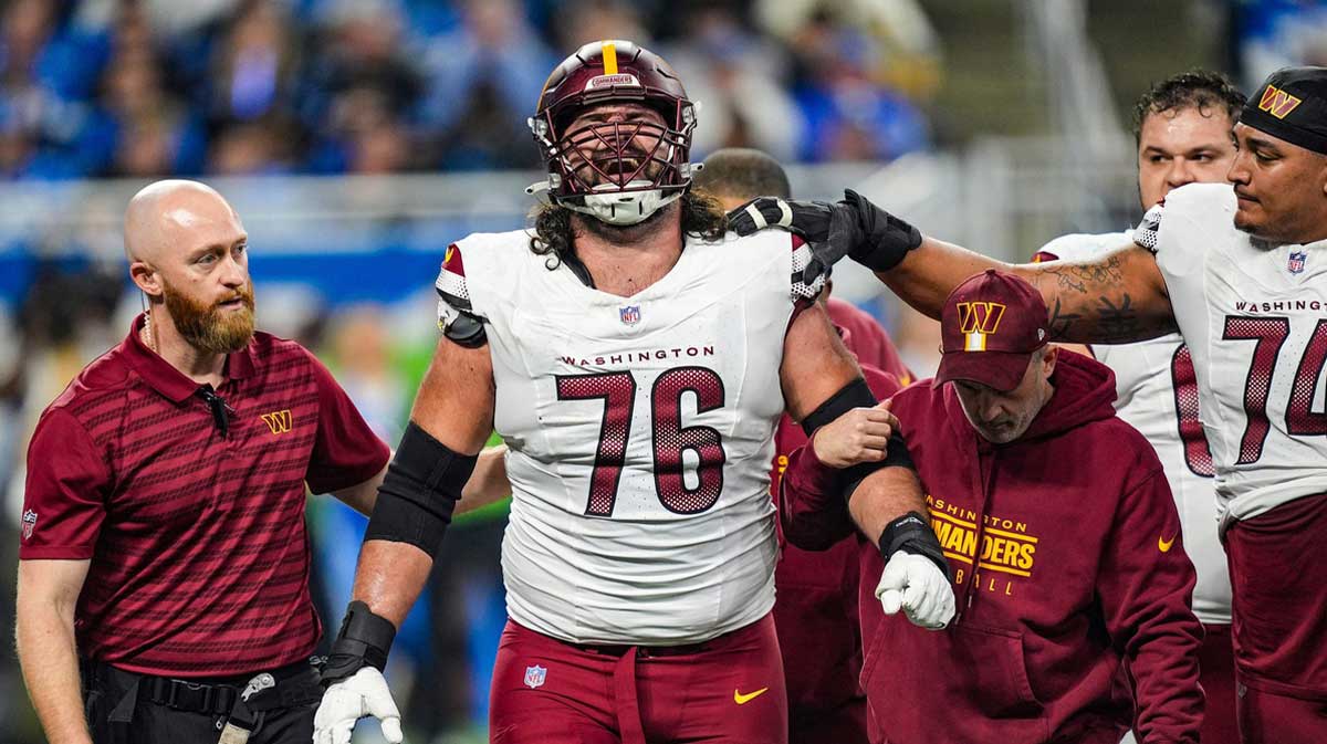 Washington Commanders guard Sam Cosmi (76) reacts as he walks off the field in the NFC divisional round at Ford Field in Detroit on Saturday, Jan. 18, 2025.