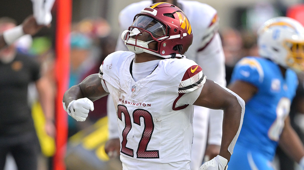 Washington Commanders running back Jacory Croskey-Merritt (22) reacts after a first down against the Los Angeles Chargers in the second half at SoFi Stadium.