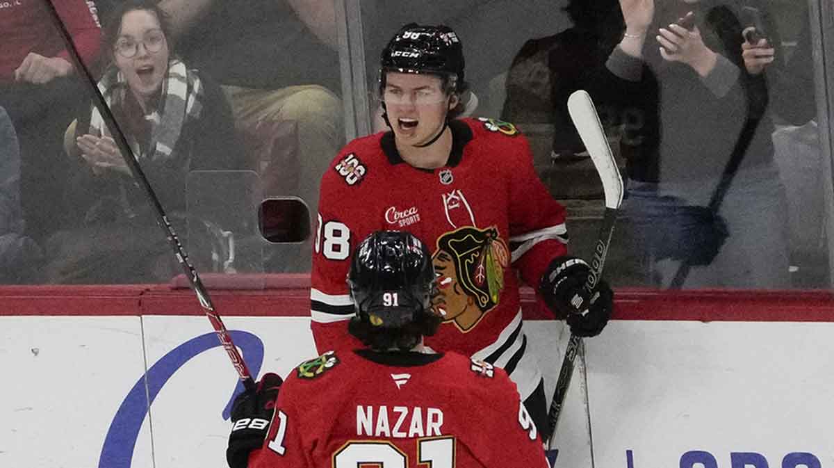 Chicago Blackhawks center Connor Bedard (98) celebrates his goal against the Ottawa Senators with center Frank Nazar (91) during the first period at United Center.