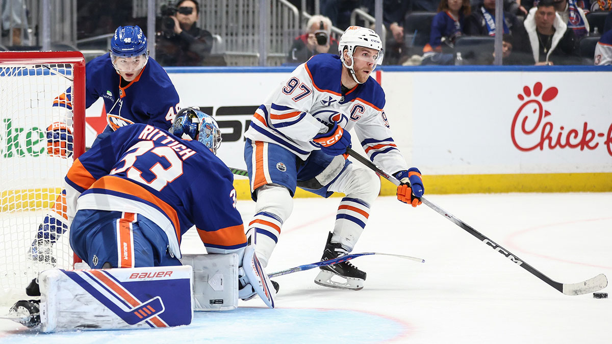 New York Islanders goaltender David Rittich (33) defends against a shot on goal attempt by Edmonton Oilers center Connor McDavid (97) in the third period at UBS Arena.