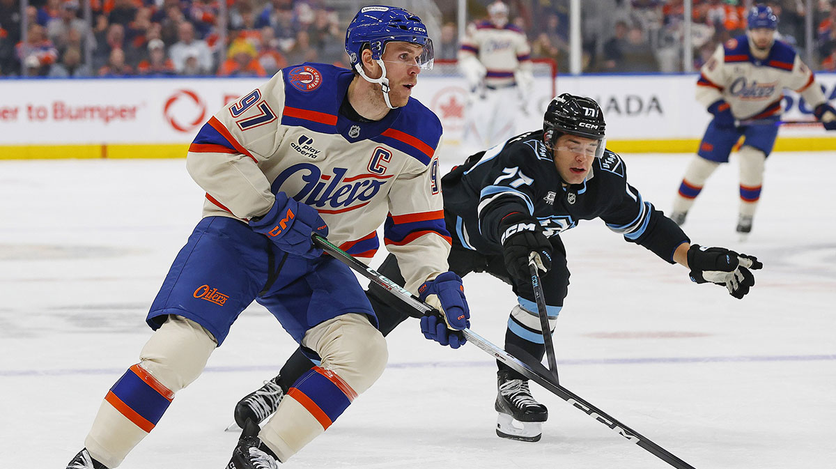 Edmonton Oilers forward Connor McDavid (97) looks to make a pass in front of Utah Mammoth forward JJ Peterka (77) during the first period at Rogers Place