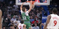 Dallas Mavericks forward Cooper Flagg (32) dunks the ball past Toronto Raptors forward Scottie Barnes (4) during the first quarter at the American Airlines Center.