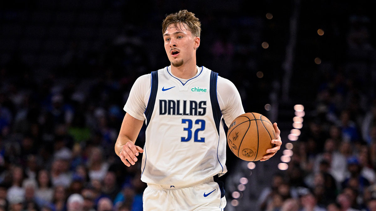 Dallas Mavericks forward Cooper Flagg (32) brings the ball up court during the game between the Dallas Mavericks and the Oklahoma City Thunder at Dickie's Arena.
