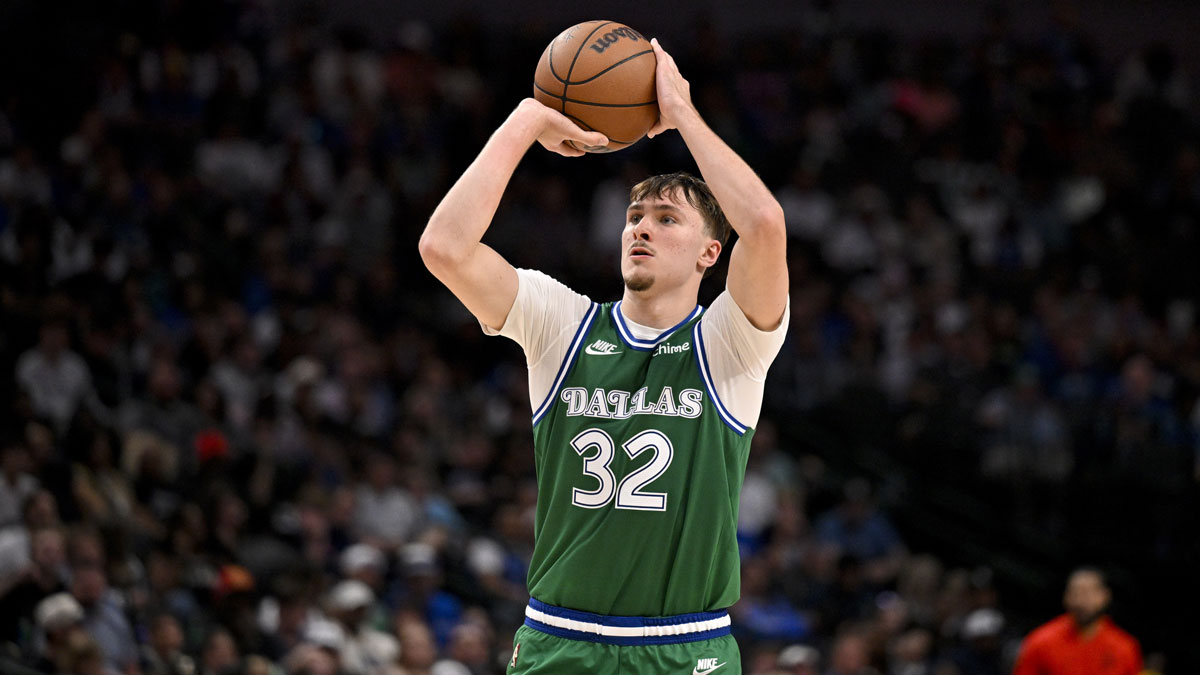 Dallas Mavericks forward Cooper Flagg (32) makes a three point shot against the Toronto Raptors during the second half at the American Airlines Center.