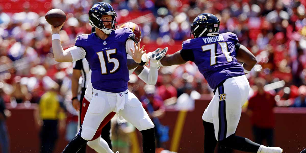 Baltimore Ravens quarterback Cooper Rush (15) throws a pass during the second quarter against the Washington Commanders at Northwest Stadium.
