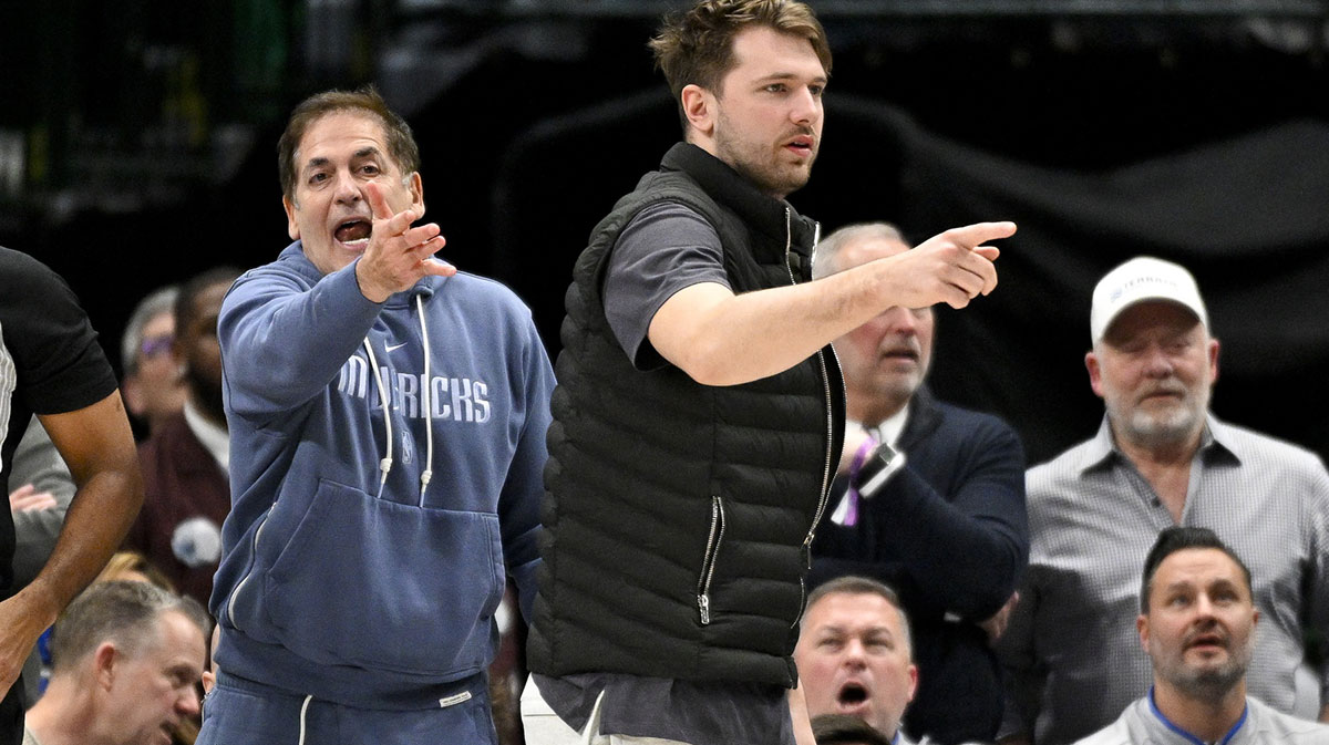 Dallas Mavericks guard Luka Doncic (right) and Mark Cuban (left) argue a call during the second half of the game against the New Orleans Pelicans at the American Airlines Center