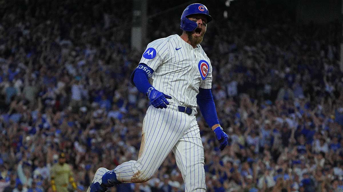 Chicago Cubs first baseman Michael Busch (29) reacts after hitting a one run home run during the seventh inning against the San Diego Padres during game three of the Wildcard round for the 2025 MLB playoffs at Wrigley Field.
