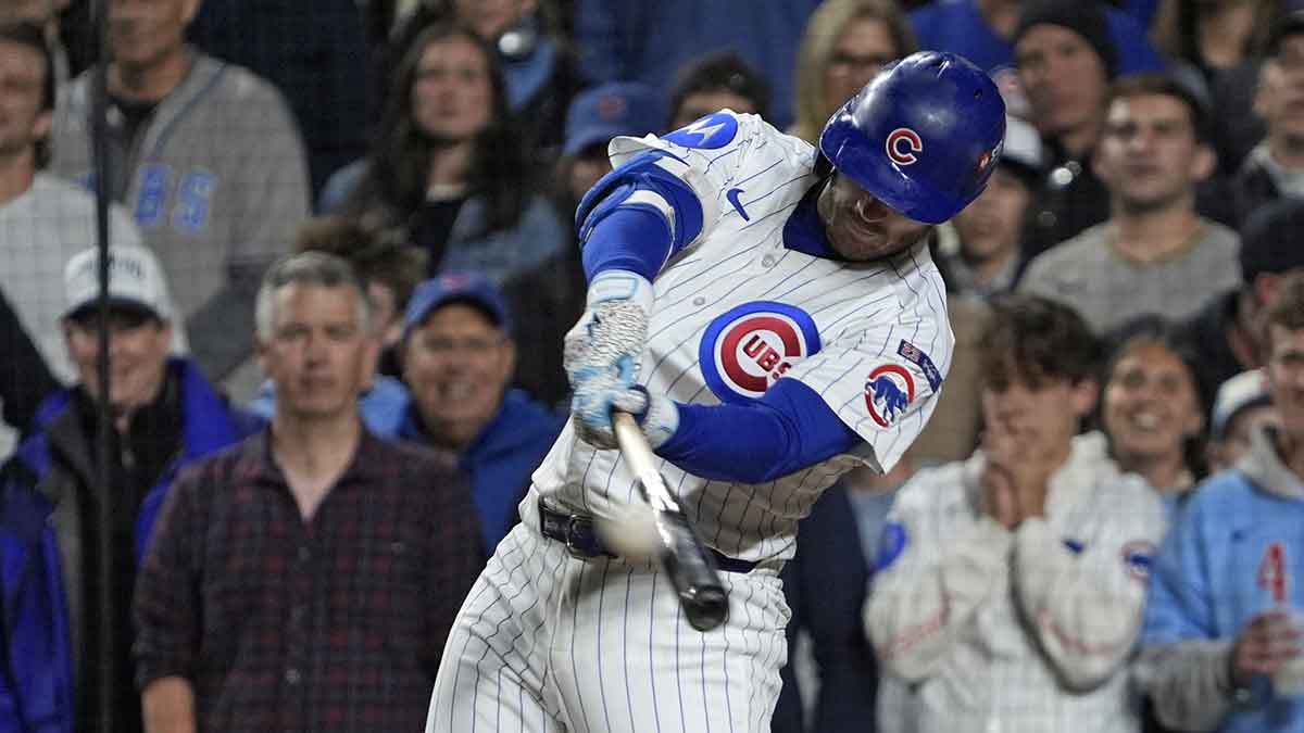 Chicago Cubs left fielder Ian Happ (8) hits a three run home run against the Milwaukee Brewers during the first inning for game four of the NLDS round for the 2025 MLB playoffs at Wrigley Field.
