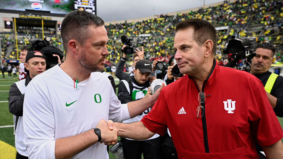 Oregon Ducks head coach Dan Lanning shakes hands with Indiana Hoosiers head coach Curt Cignetti after Indiana defeated Oregon by the score of 30-20 at Autzen Stadium.