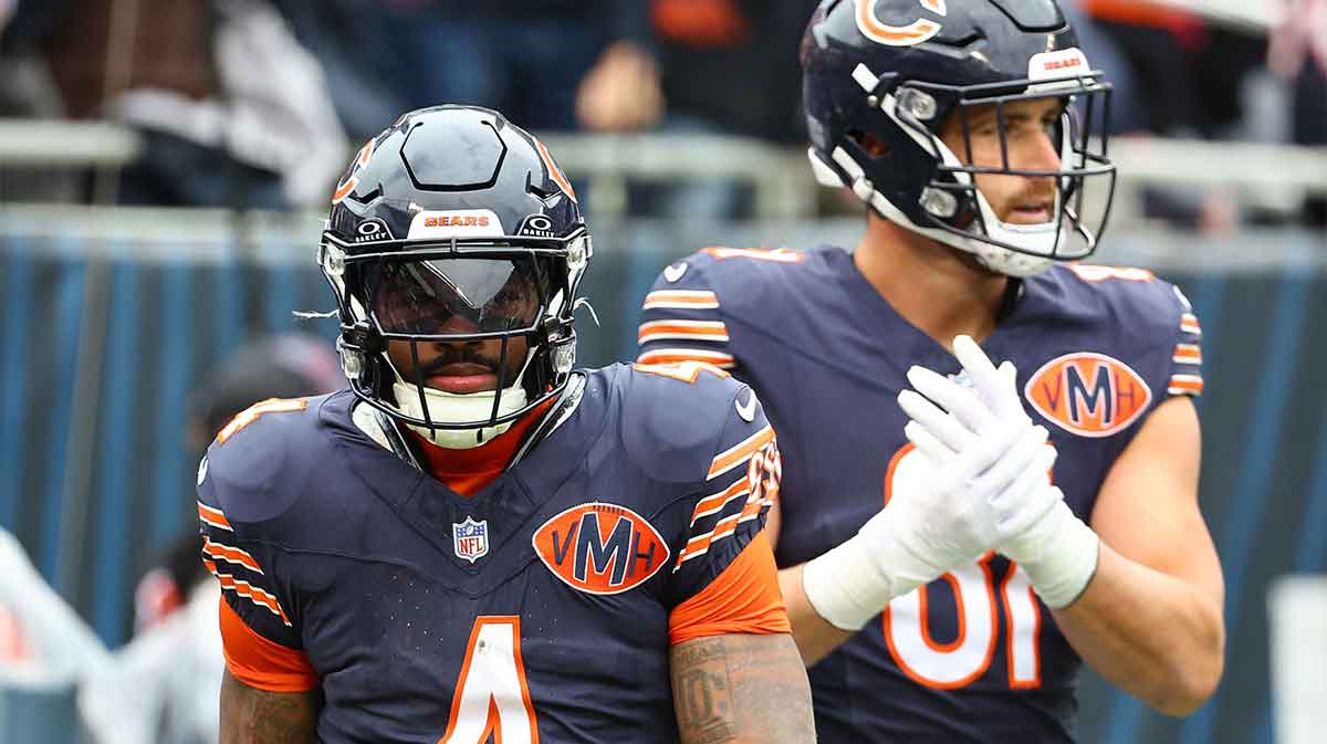 Chicago Bears running back D'Andre Swift (4) reacts after rushing for a touchdown against the New Orleans Saints during the second quarter at Soldier Field.