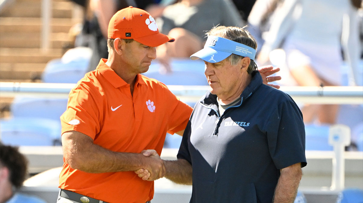 Clemson Tigers head coach Dabo Swinney with North Carolina Tar Heels head coach Bill Belichick before the game at Kenan Stadium.