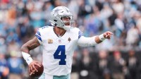 Dallas Cowboys quarterback Dak Prescott (4) communicates during the second half against the Carolina Panthers at Bank of America Stadium.