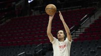 Portland Trail Blazers guard Dalano Banton (5) warms up before a game against the Denver Nuggets at Moda Center.