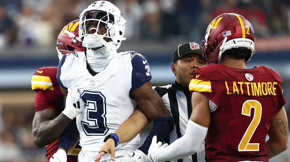 Dallas Cowboys wide receiver George Pickens (3) celebrates after a play as Washington Commanders safety Quan Martin (20) and cornerback Marshon Lattimore (2) look on during the second quarter of the game at AT&T Stadium.