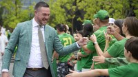 Oregon Ducks head coach Dan Lanning greets fans before a game against the Oklahoma State Cowboys at Autzen Stadium.