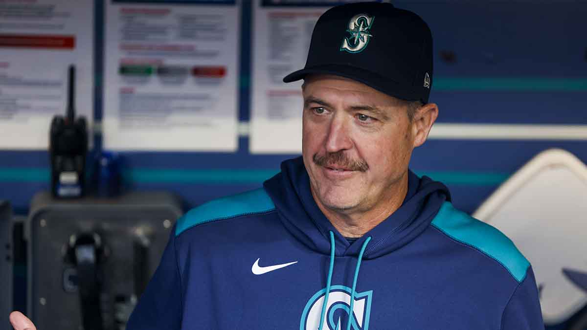 Seattle Mariners manager Dan Wilson (6) talks in the dugout before a game against the Colorado Rockies at T-Mobile Park.