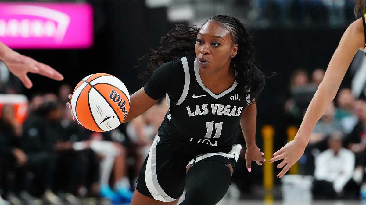 Las Vegas Aces guard Dana Evans (11) dribbles against the Chicago Sky during the fourth quarter at T-Mobile Arena.