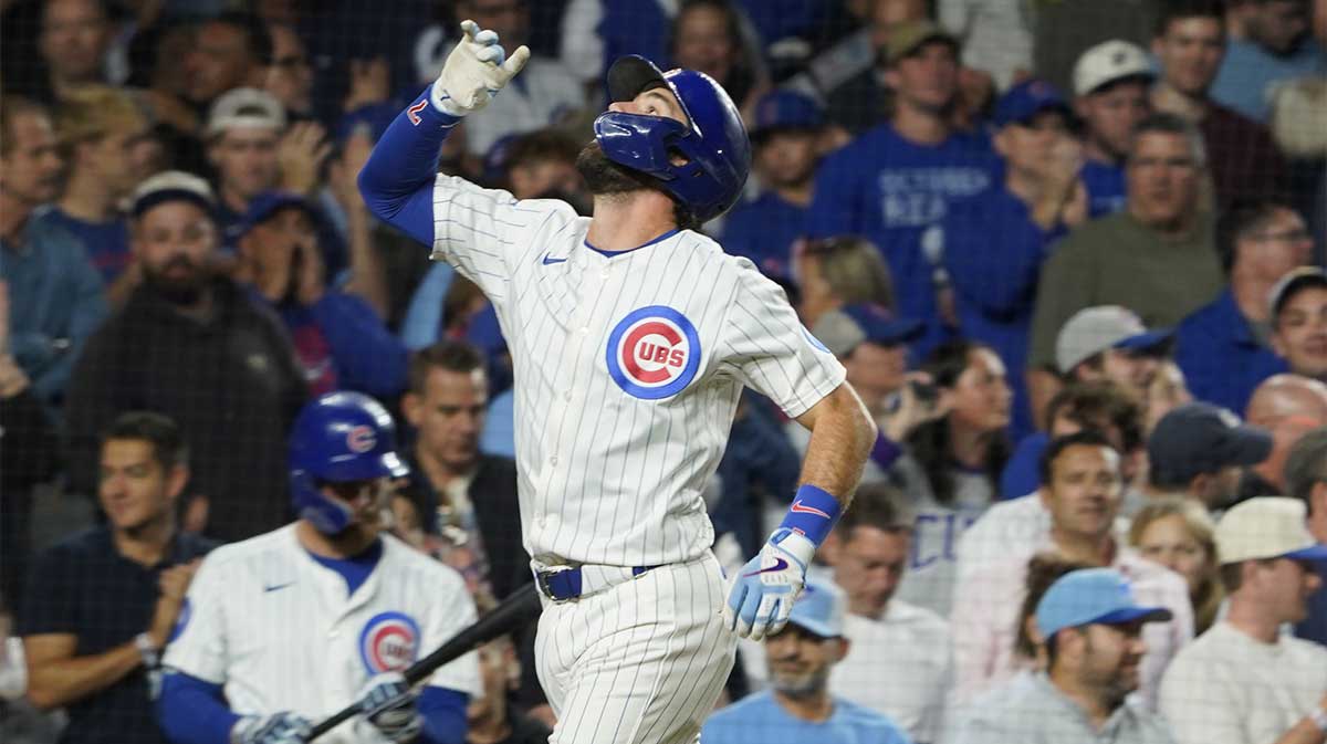 Chicago Cubs shortstop Dansby Swanson (7) gestures after hitting a home run against the New York Mets during the fifth inning at Wrigley Field.