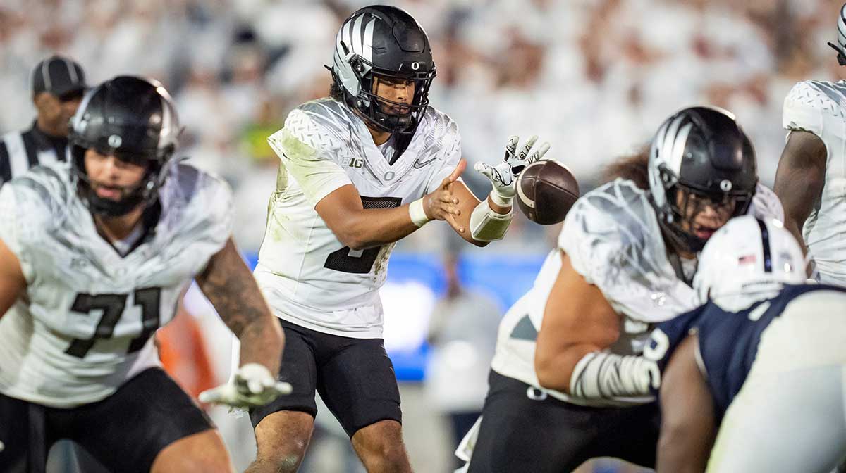 Oregon quarterback Dante Moore takes a snap as the Oregon Ducks face the Penn State Nittany Lions on Sept. 27, 2025, at Beaver Stadium in University Park, Pennsylvania.