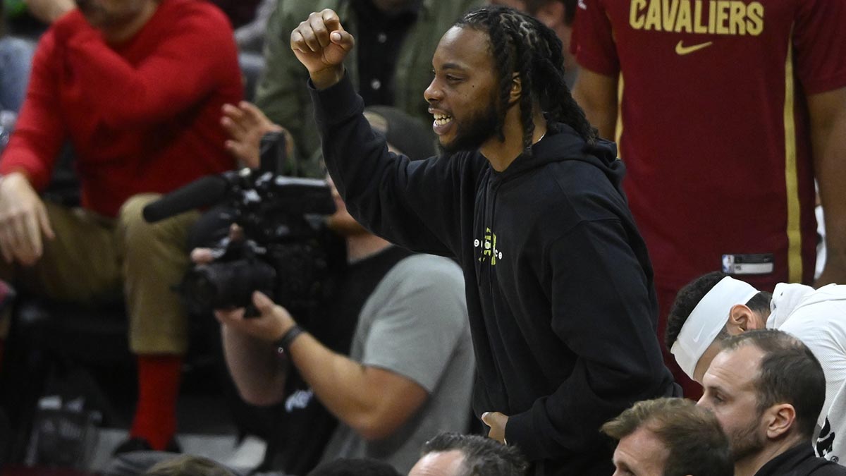 Cleveland Cavaliers guard Darius Garland (10) cheers from the bench in the fourth quarter against the Detroit Pistons at Rocket Arena.