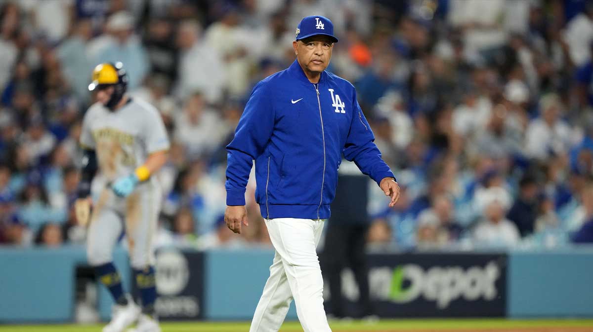 Los Angeles Dodgers manager Dave Roberts (30) walks to the mound in the eighth inning against the Milwaukee Brewers during game four of the NLCS round for the 2025 MLB playoffs at Dodger Stadium.