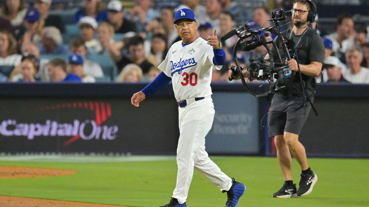 Los Angeles Dodgers manager Dave Roberts (30) makes a pitching change during the seventh inning against the Toronto Blue Jays during game four of the 2025 MLB World Series at Dodger Stadium.