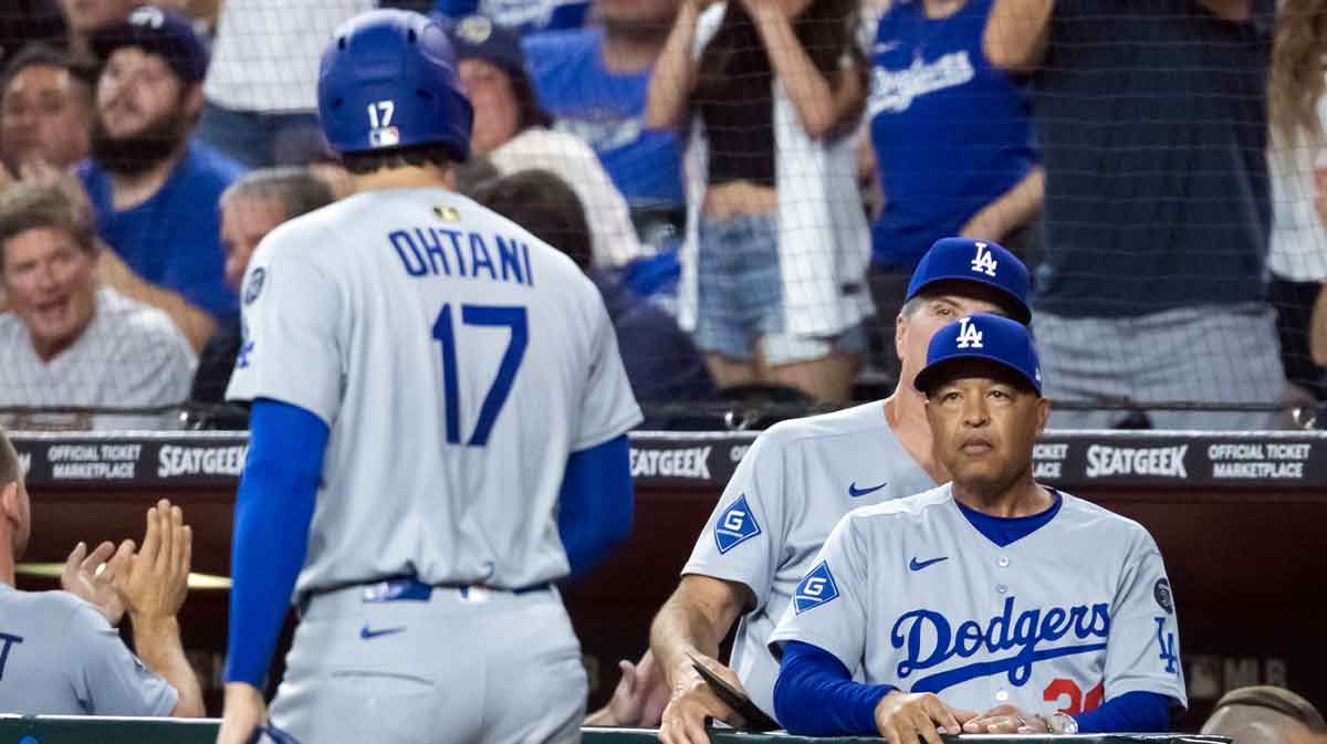 Los Angeles Dodgers manager Dave Roberts looks at pitcher/designated hitter Shohei Ohtani against the Arizona Diamondbacks at Chase Field.