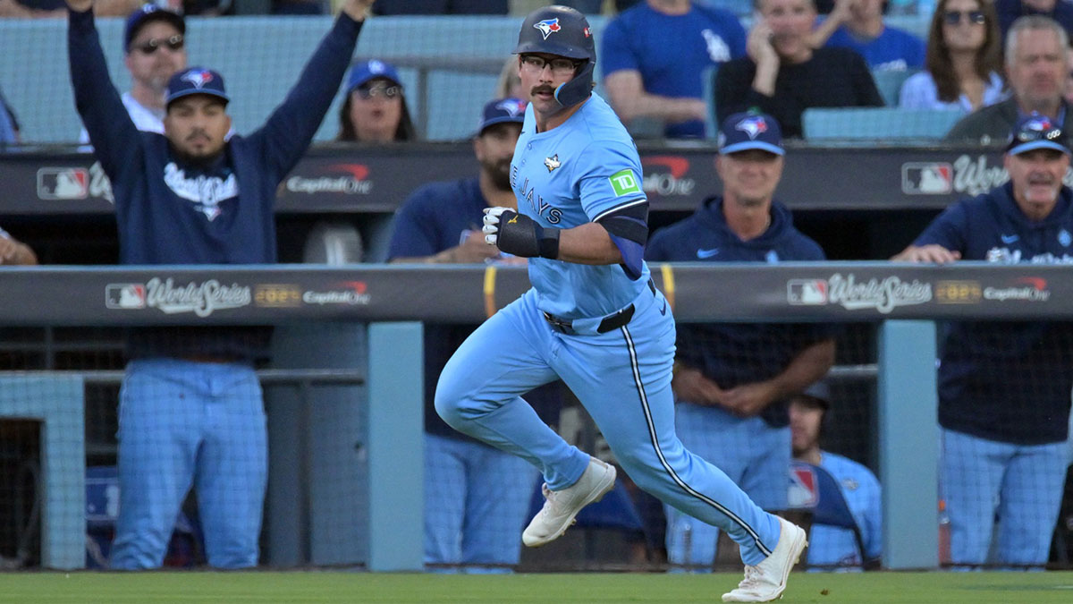 Toronto Blue Jays left fielder Davis Schneider (36) runs after hitting a home run against the Los Angeles Dodgers in the first inning during game five of the 2025 MLB World Series at Dodger Stadium. Mandatory Credit: Jayne Kamin-Oncea-Imagn Images