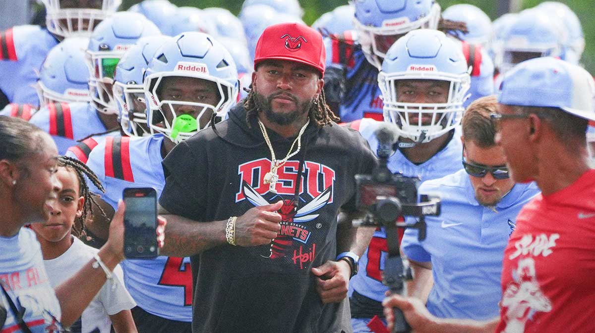 Delaware State head coach DeSean Jackson leads his team onto the field before taking on Albany at Alumni Stadium in Dover, Del. Sept. 6, 2025.