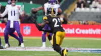 Pittsburgh Steelers safety Deshon Elliott (25) intercepts a pass against Minnesota Vikings quarterback Carson Wentz (11) during an NFL International Series game at Croke Park.